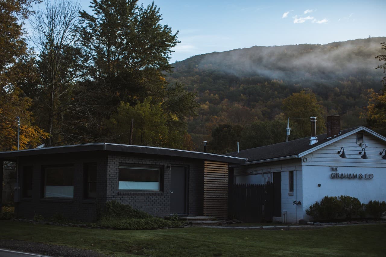 The Graham & Co hotel building with Catskills mountains in the background
